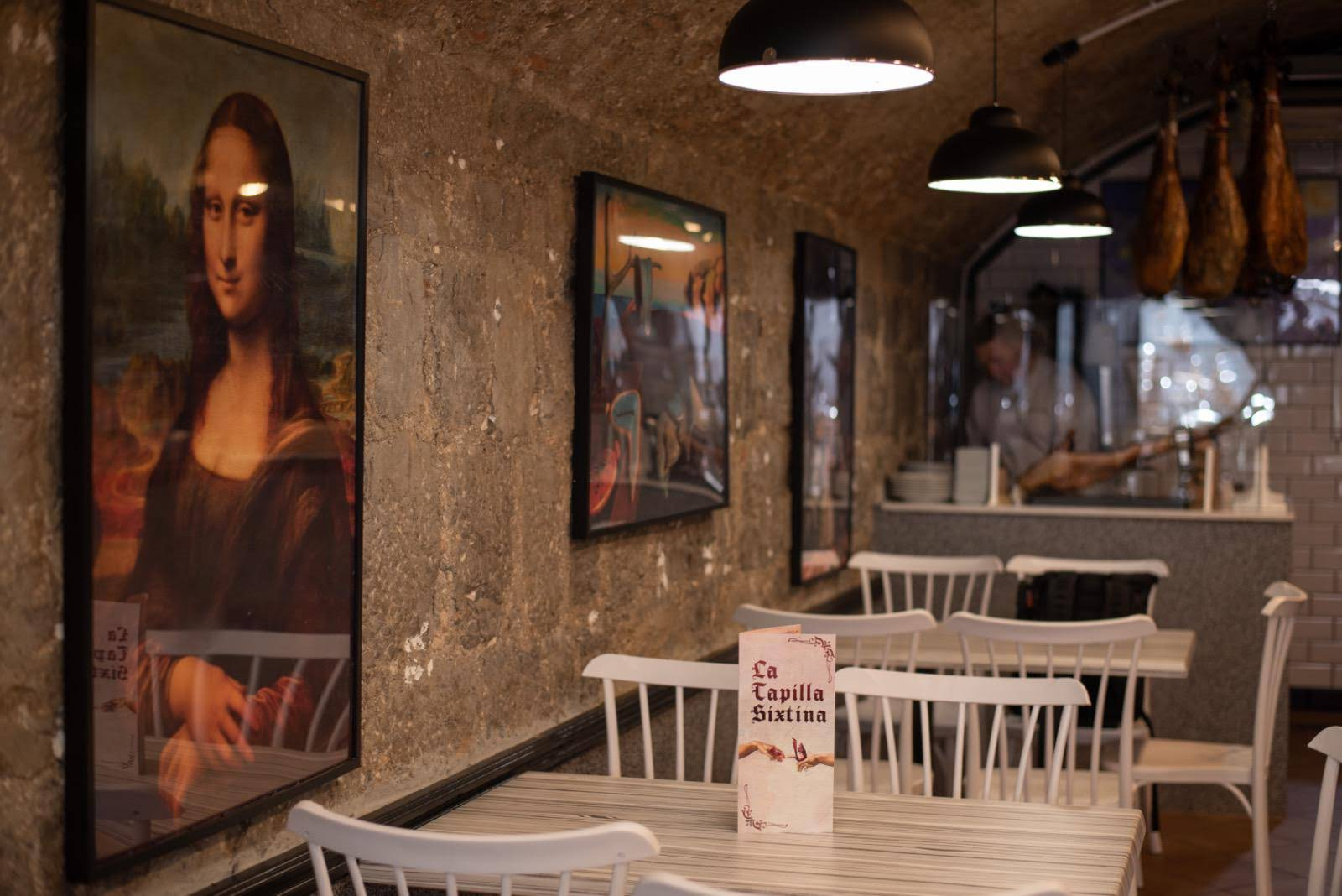 Interior of La Tapilla Sixtina with warm ambiance